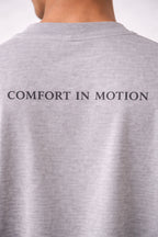 Comfort in Motion Unisex Oversized T-Shirt – Flow Leaf Minimal Design | Stone Grey
